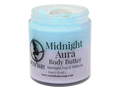 half blue half purple body butter in a glass jar with a moonstone on top and a clear label that reads: Midnight Aura Body Butter. Midnight Fog & Hibiscus.