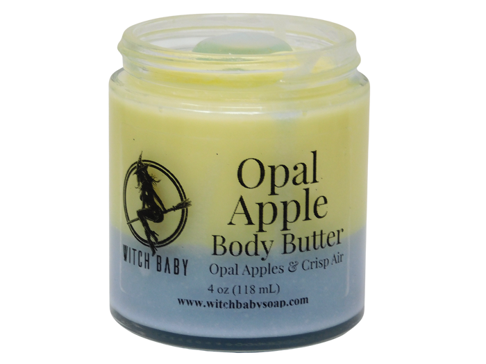A jar of Witch Baby Opal Apple Body Butter with a pale yellow and a blue gradient body butter, shown on a plain white background.
