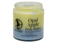 A jar of Witch Baby Opal Apple Body Butter with a pale yellow and a blue gradient body butter, shown on a plain white background.