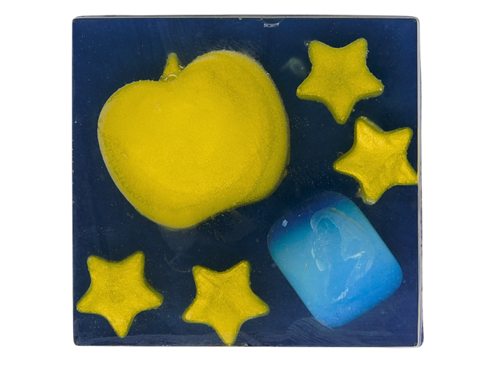 A square blue and yellow fall themed design with a large yellow apple, four yellow stars, and a opalite crystal on a dark navy blue background.