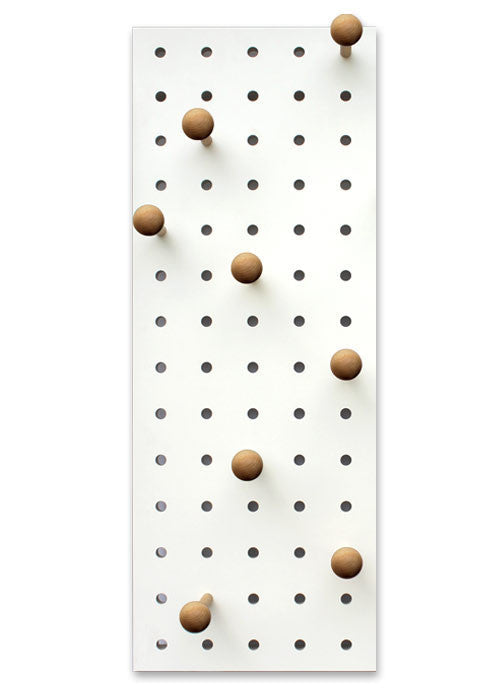 white wood pegboard with pegs hooks