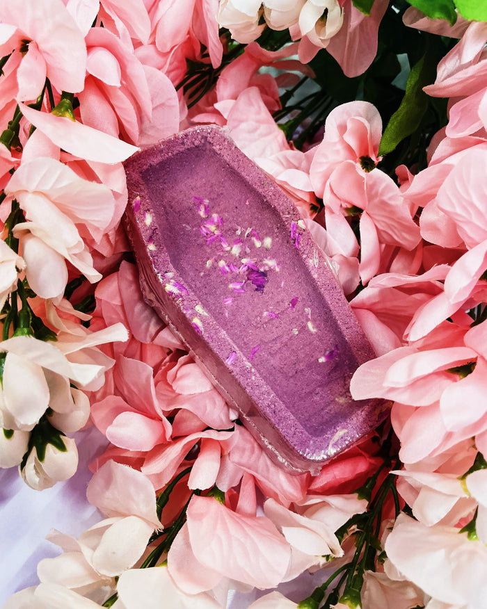 persephone bath bomb in a bed of flowers