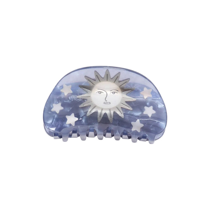Hair clip with sun and star design on a white background
