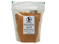 A clear plastic stand-up pouch containing an orange-brown bath potion powder, with a white label reading 'Witch Baby Pumpkin Spell Bath Potion' on a white background.