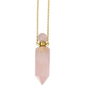 Necklace with a pink crystal pendant on a white background