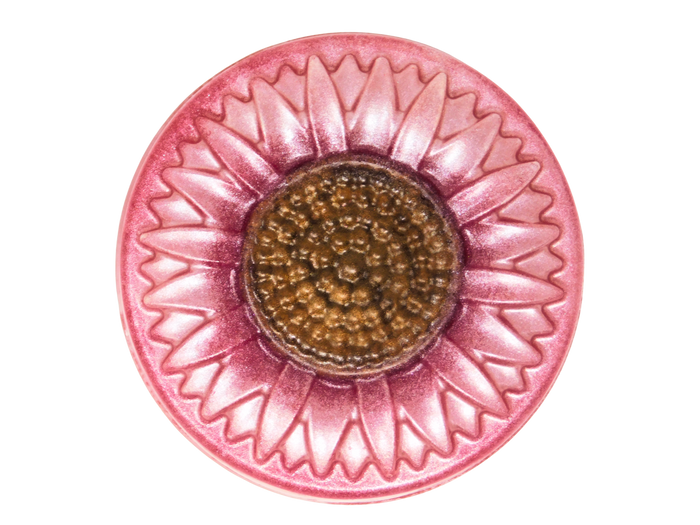 Decorative pink sunflower soap with a brown center on a white background