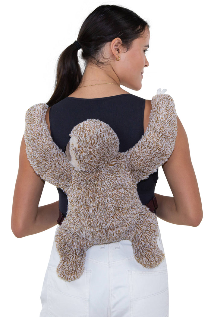 Sloth furry backpack side view showing zippered main compartment and soft brown plush fur texture, white background