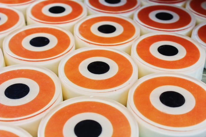 tray of orange evil eye soaps