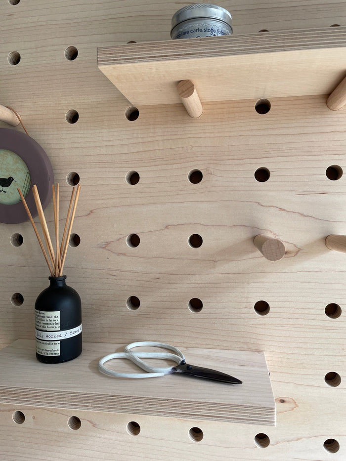 detail of maple veneer pegboard by Kreisdesign