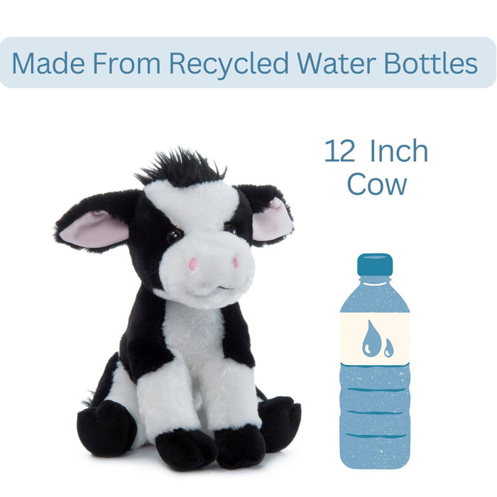 Side view of Wild Onez cow plush sitting and looking left, showing black and white spotted body, floppy ears, and short tail, white background