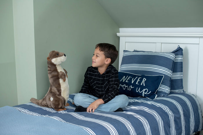 Front-facing view of Wild Onez river otter plush showing cream muzzle, black nose, and glossy black eyes, white background